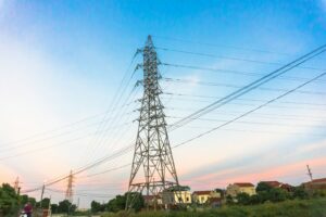 black electric tower under blue sky during daytime